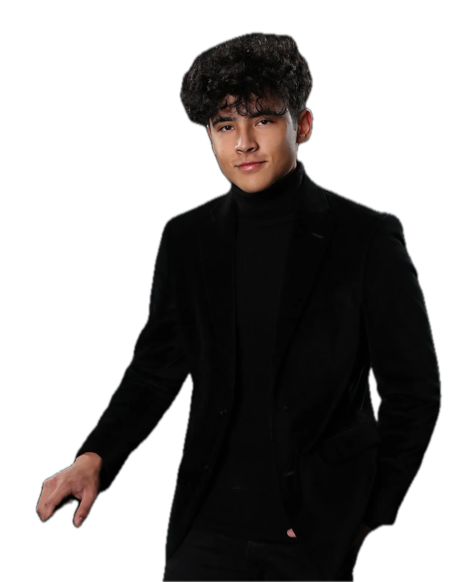 Senior portrait in the studio against a black backdrop