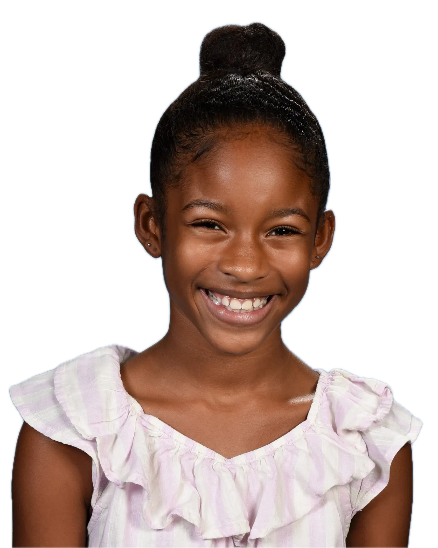 Girl with her hair in a top bun and a big open smile, wearing a lilac-and-white ruffled top, on a light-blue painterly backdrop